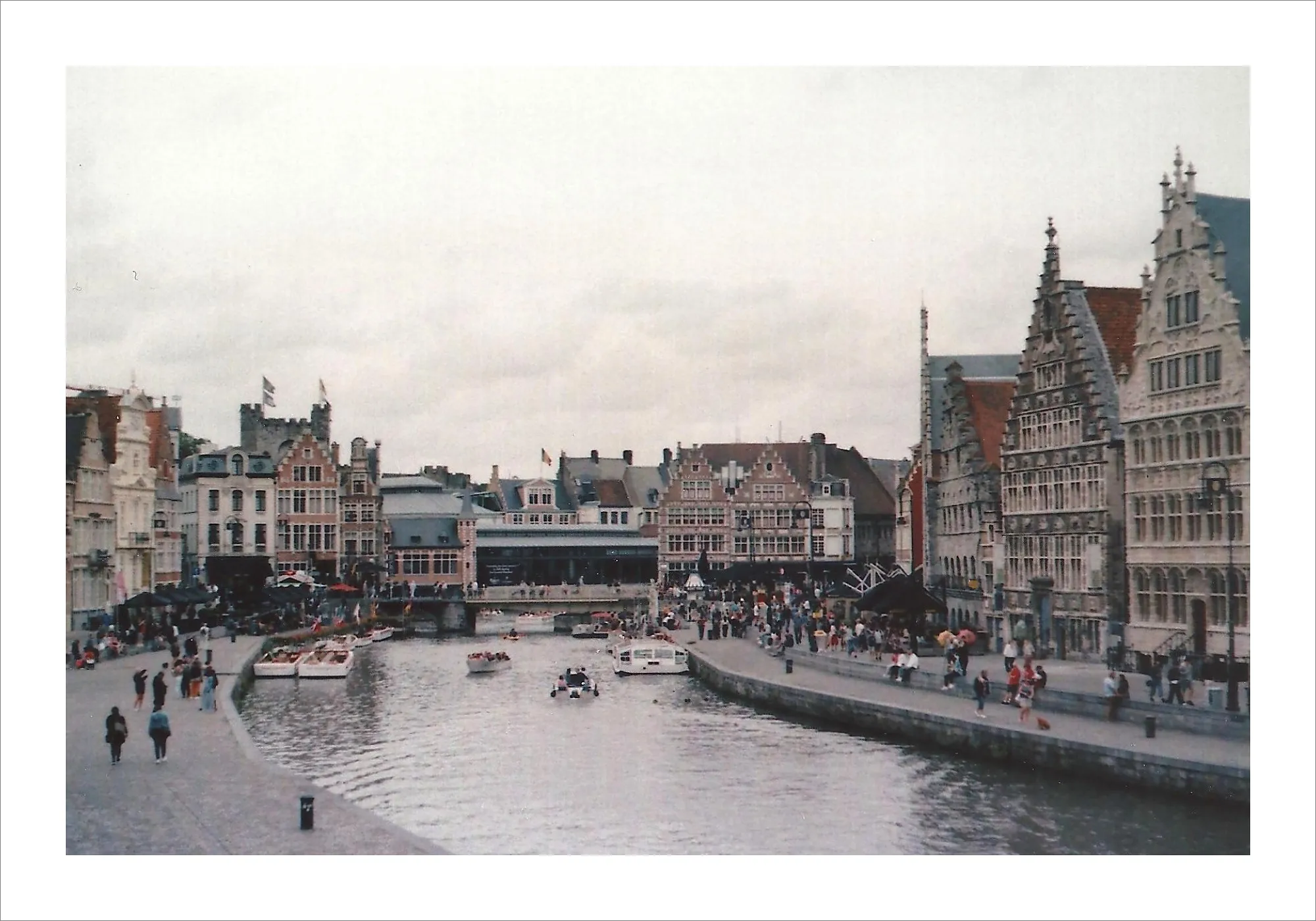 Historic guild houses along Ghent canal in Belgium on film.