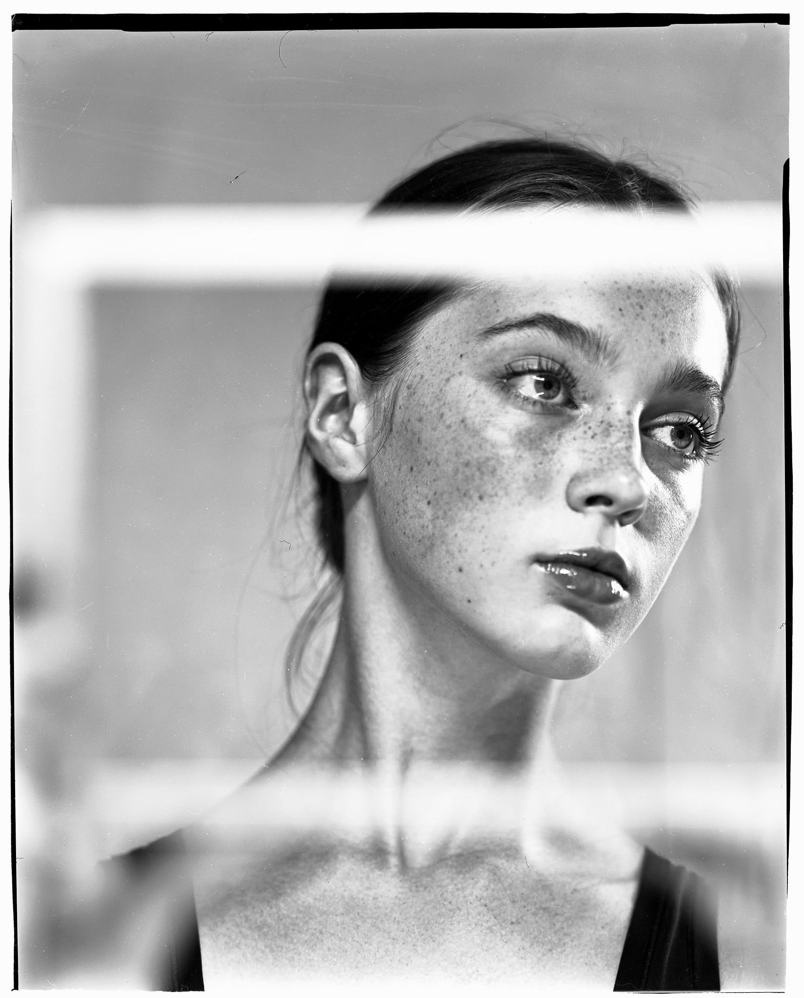 Portrait of a freckle-faced model on large format film.