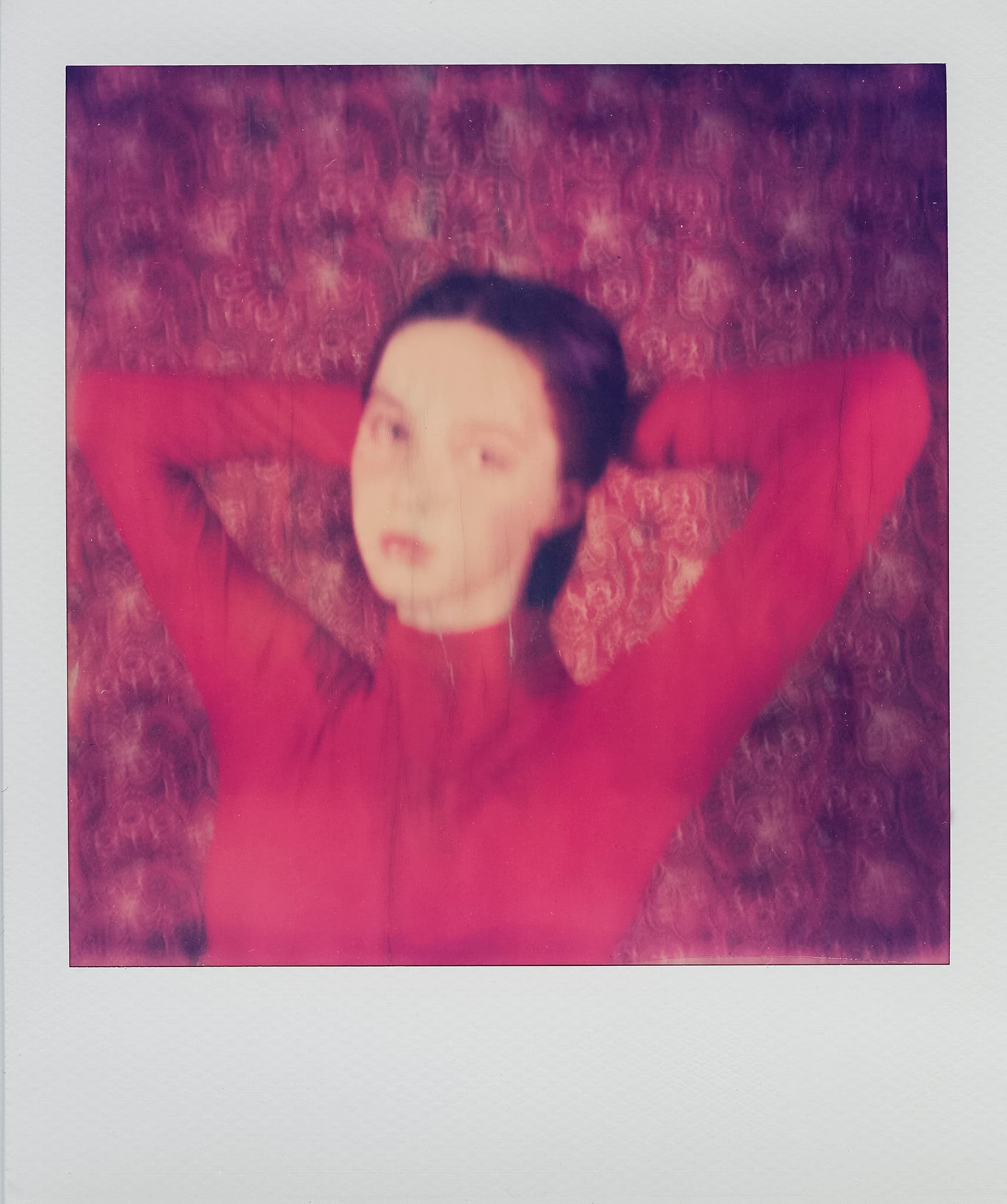 Soft-focus portrait in magenta tones on SX-70 instant film.