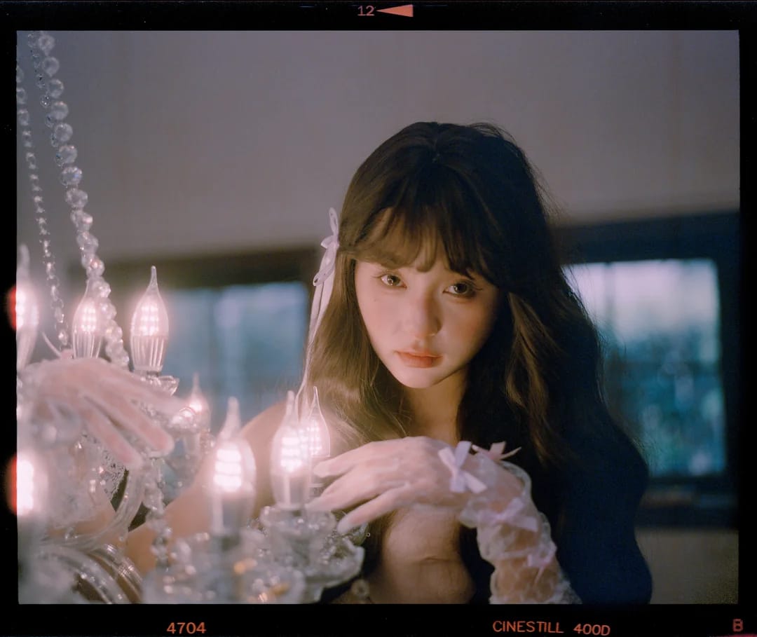 Asian model portrait with soft lighting and shallow depth of field on film.