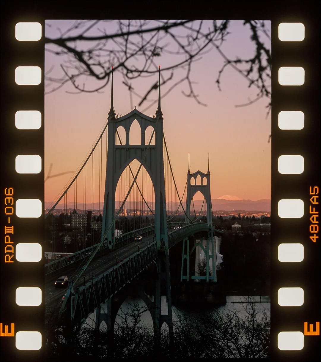 St. Johns Bridge at sunset with sprocket holes visible on film borders.